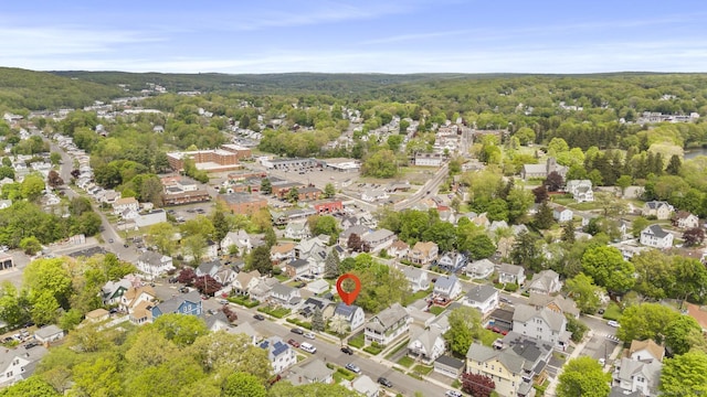 aerial perspective of suburban area with a forest