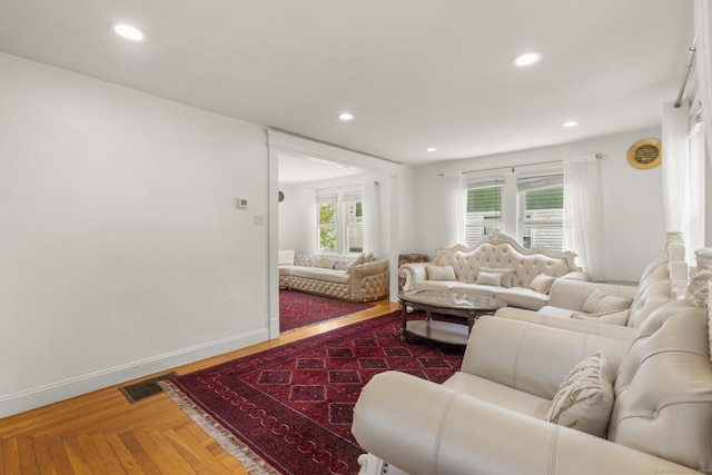 living room featuring recessed lighting and baseboards