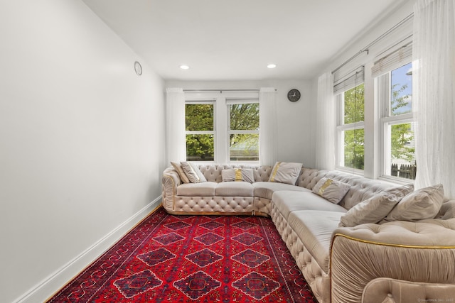 living room with baseboards and recessed lighting