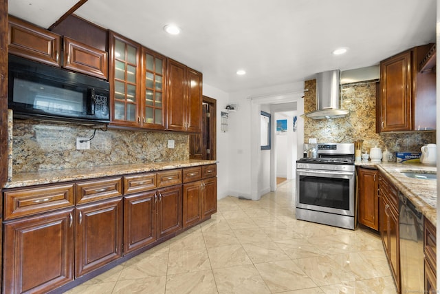 kitchen with gas stove, wall chimney exhaust hood, black microwave, tasteful backsplash, and recessed lighting