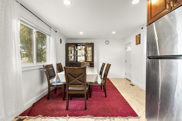 dining space featuring recessed lighting and baseboards