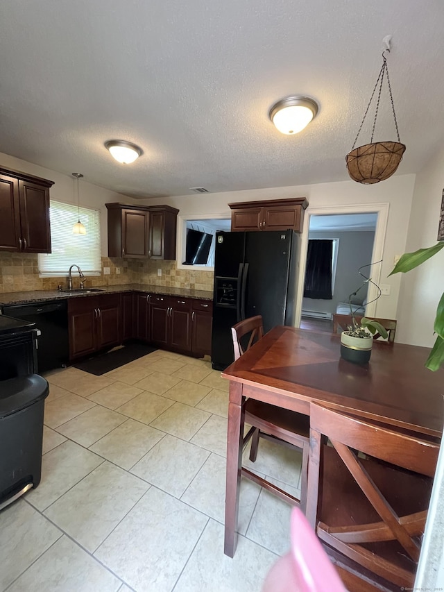 kitchen with black appliances, dark brown cabinets, decorative backsplash, a sink, and light tile patterned flooring