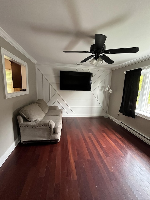 unfurnished room featuring crown molding, baseboards, dark wood finished floors, and a ceiling fan