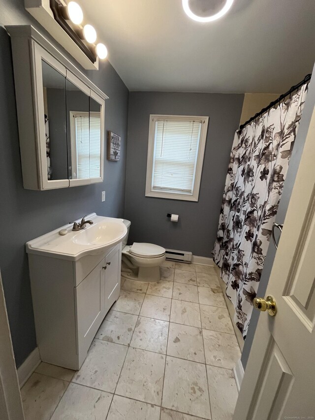 bathroom featuring baseboard heating, toilet, vanity, baseboards, and a shower with curtain