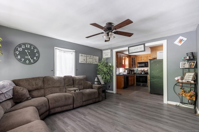348 Harwinton Ave, Torrington, CT 06790 - living room featuring ceiling fan, wood finished floors, and baseboards
