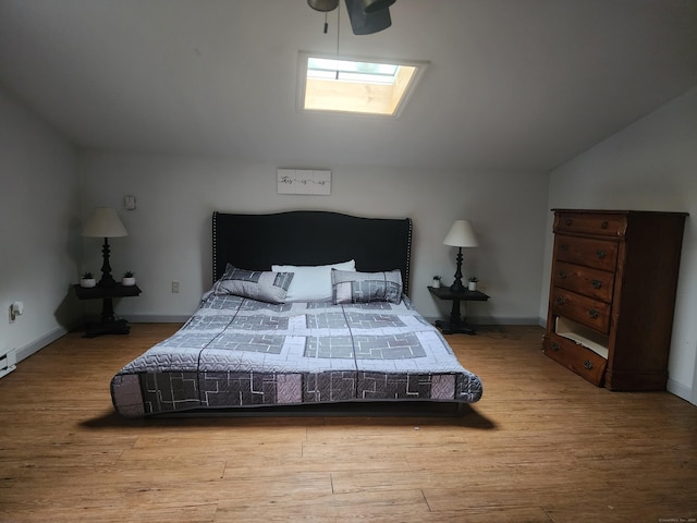 348 Harwinton Ave, Torrington, CT 06790 - bedroom with a skylight, lofted ceiling, and wood finished floors