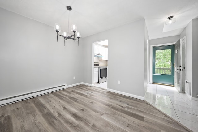 1400 Meriden Rd Apt 1-2, Waterbury, CT 06705 - unfurnished dining area with a chandelier, baseboards, and light wood-type flooring