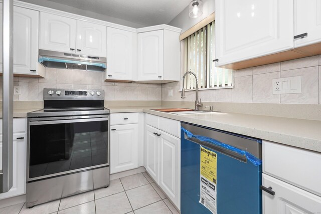 1400 Meriden Rd Apt 1-2, Waterbury, CT 06705 - kitchen with electric range, under cabinet range hood, dishwashing machine, a sink, and white cabinets