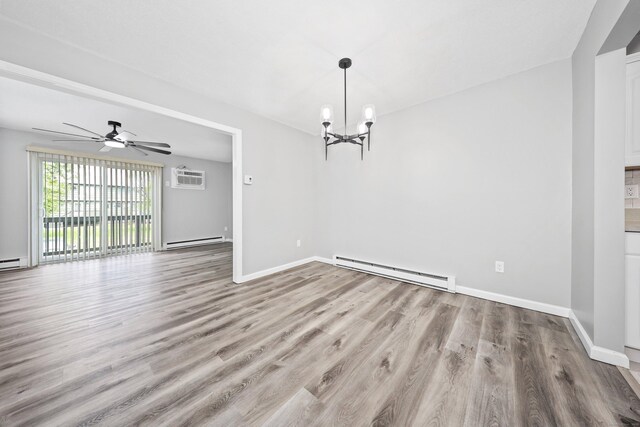 1400 Meriden Rd Apt 1-2, Waterbury, CT 06705 - unfurnished dining area featuring a baseboard radiator, wood finished floors, a chandelier, and a wall mounted air conditioner