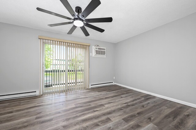 1400 Meriden Rd Apt 1-2, Waterbury, CT 06705 - spare room featuring baseboard heating, a wall mounted air conditioner, wood finished floors, ceiling fan, and baseboards