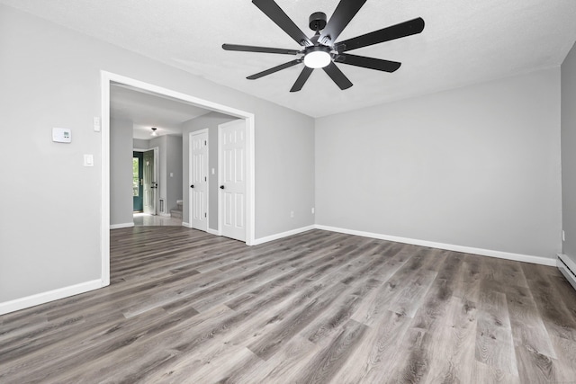 1400 Meriden Rd Apt 1-2, Waterbury, CT 06705 - empty room with wood finished floors, a ceiling fan, and baseboards
