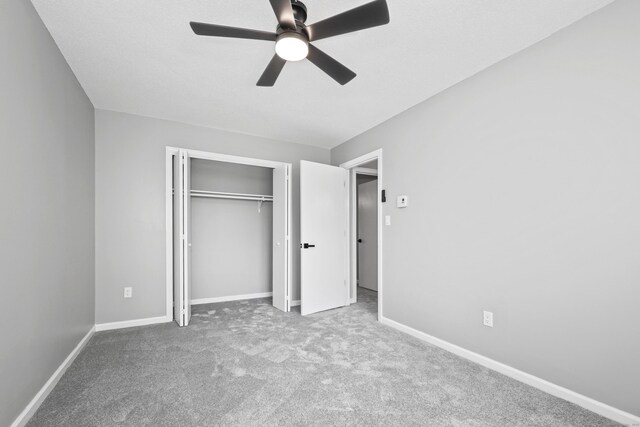 1400 Meriden Rd Apt 1-2, Waterbury, CT 06705 - unfurnished bedroom featuring carpet floors, baseboards, a closet, and a ceiling fan