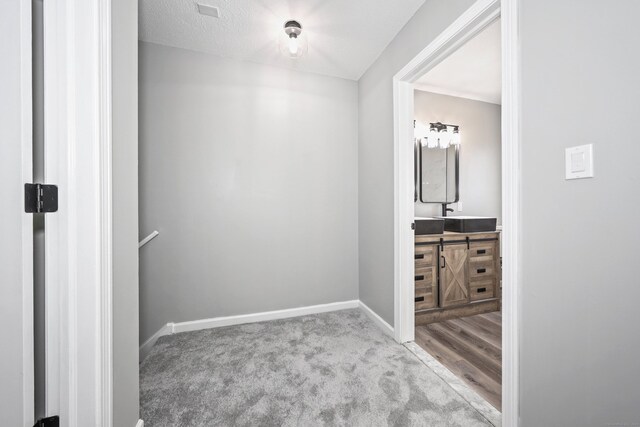 1400 Meriden Rd Apt 1-2, Waterbury, CT 06705 - hallway with carpet floors, baseboards, and a sink