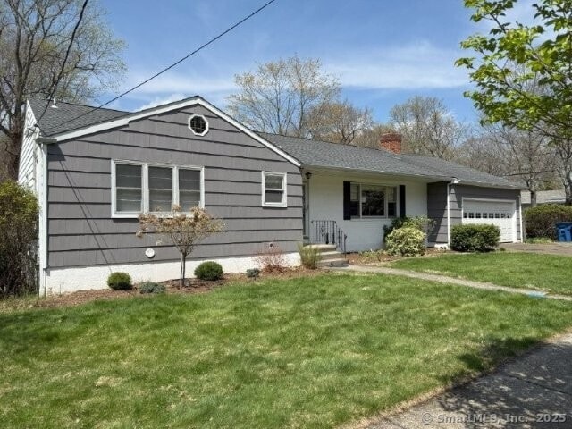 6 Spencer Pl, New Haven, CT 06515 - single story home with a garage, a chimney, and a front lawn