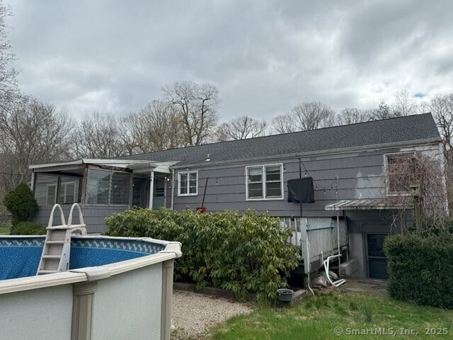 6 Spencer Pl, New Haven, CT 06515 - rear view of house with an outdoor pool and a sunroom
