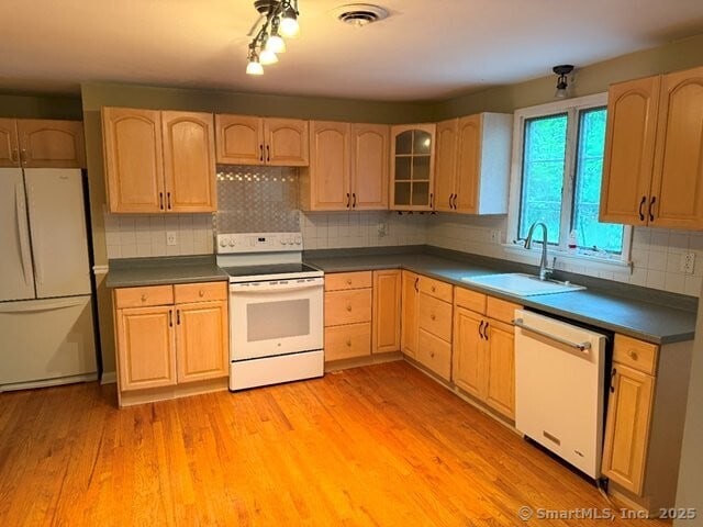 6 Spencer Pl, New Haven, CT 06515 - kitchen featuring white appliances, a sink, light brown cabinets, light wood-style floors, and dark countertops