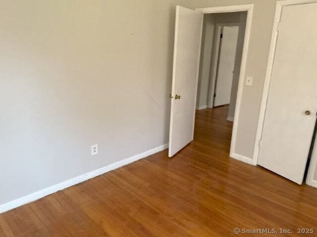 6 Spencer Pl, New Haven, CT 06515 - empty room featuring baseboards and light wood-style flooring