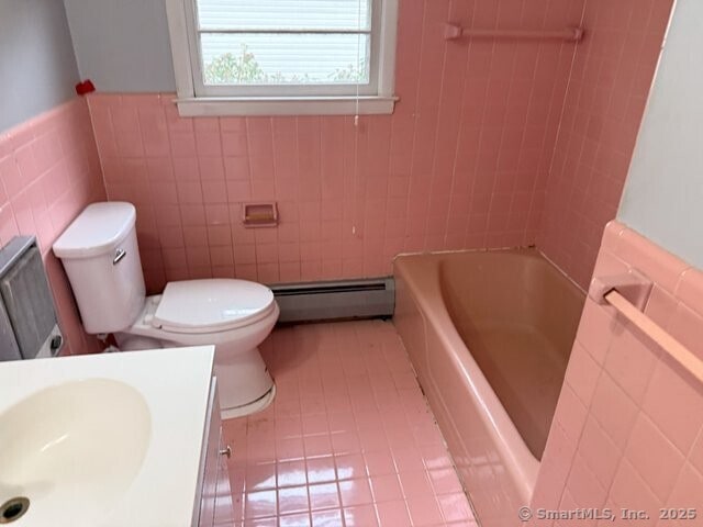 6 Spencer Pl, New Haven, CT 06515 - bathroom featuring baseboard heating, tile walls, toilet, tile patterned flooring, and vanity