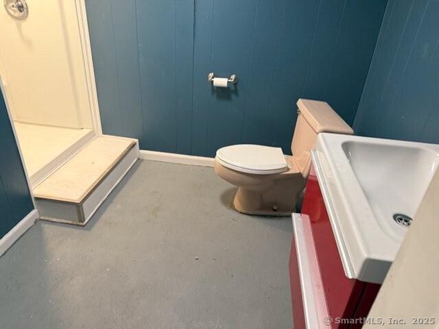 6 Spencer Pl, New Haven, CT 06515 - half bathroom with concrete flooring, toilet, baseboards, and vanity