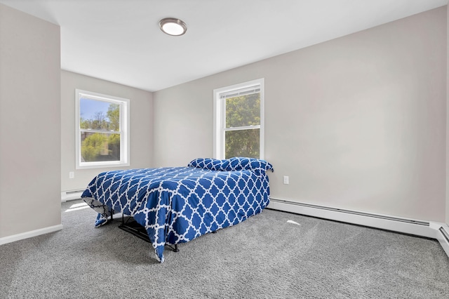 carpeted bedroom with a baseboard radiator, baseboards, and a baseboard heating unit