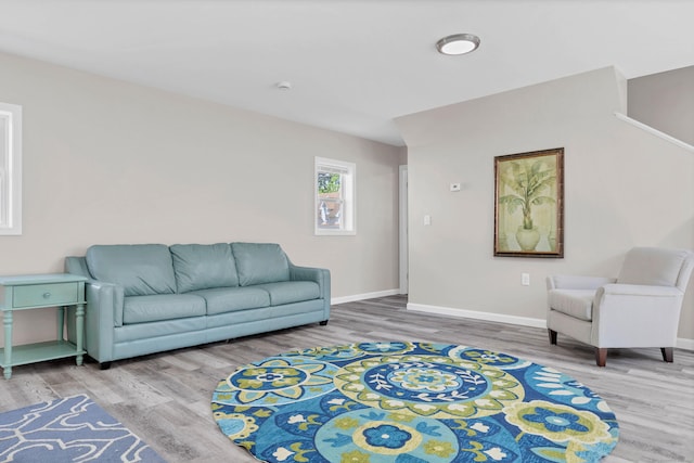 living room with wood finished floors and baseboards