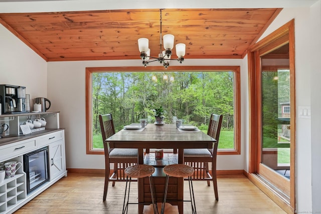 6 Knorr Rd, Oxford, CT 06478 - dining room featuring baseboards, a chandelier, light wood-style floors, plenty of natural light, and vaulted ceiling