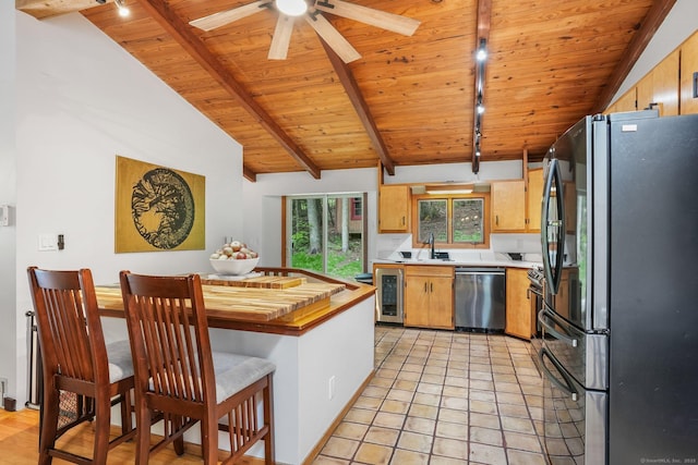6 Knorr Rd, Oxford, CT 06478 - kitchen with stainless steel appliances, rail lighting, wine cooler, a sink, and wood ceiling