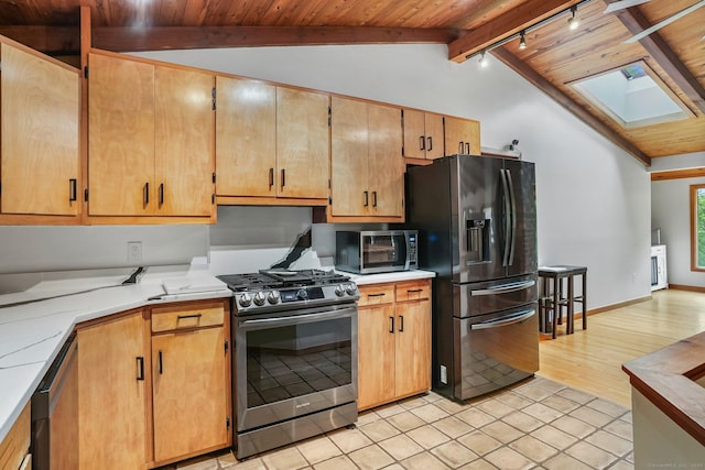 6 Knorr Rd, Oxford, CT 06478 - kitchen featuring stainless steel appliances, a skylight, wooden ceiling, light tile patterned flooring, and baseboards
