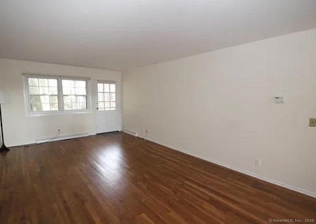245 Unquowa Rd Apt 127, Fairfield, CT 06824 - empty room featuring wood finished floors, a baseboard radiator, and baseboards