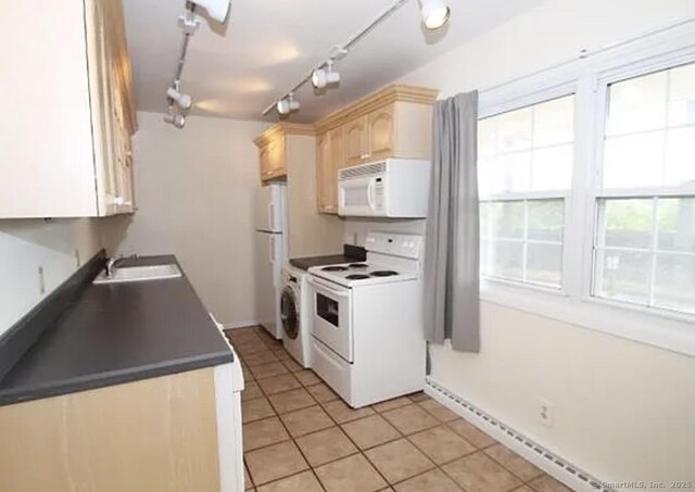 245 Unquowa Rd Apt 127, Fairfield, CT 06824 - kitchen featuring white appliances, a sink, light brown cabinetry, dark countertops, and light tile patterned floors