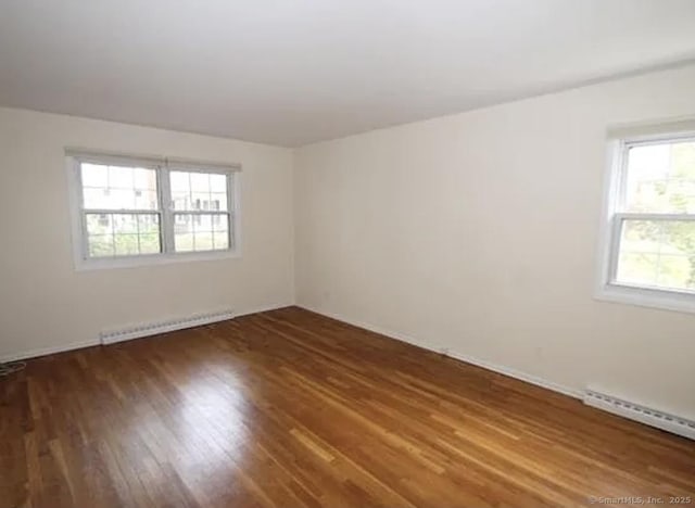 245 Unquowa Rd Apt 127, Fairfield, CT 06824 - spare room with baseboard heating and wood finished floors