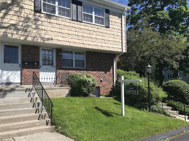 245 Unquowa Rd Apt 127, Fairfield, CT 06824 - property entrance with brick siding and mansard roof