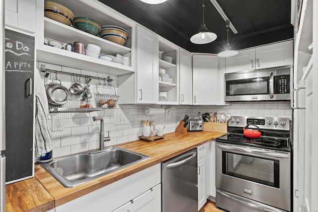 18 Hamre Ln Unit B, Branford, CT 06405 - kitchen featuring appliances with stainless steel finishes, butcher block counters, open shelves, and a sink