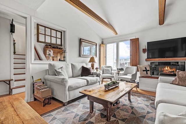 18 Hamre Ln Unit B, Branford, CT 06405 - living area featuring wood finished floors, a glass covered fireplace, and stairway