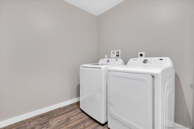 laundry room featuring separate washer and dryer, wood finished floors, and baseboards