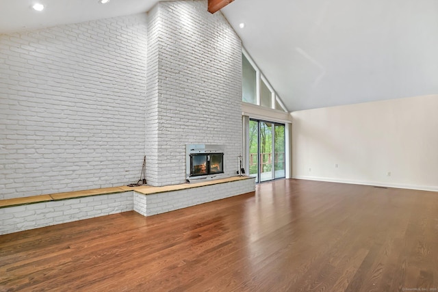 61 Stony Brook Rd, Middlebury, CT 06762 - unfurnished living room featuring high vaulted ceiling, a brick fireplace, wood finished floors, baseboards, and beamed ceiling