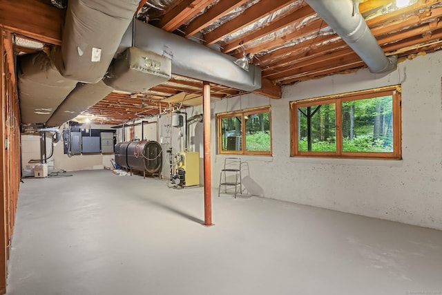 basement with a heating unit and oil tank