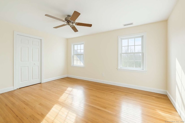 unfurnished bedroom with light wood-style floors and baseboards