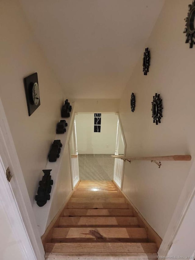 staircase with wood finished floors