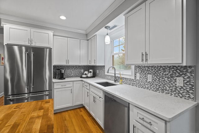 3 Arrowhead Rd, Madison, CT 06443 - kitchen with appliances with stainless steel finishes, a sink, butcher block countertops, light wood-style floors, and white cabinets