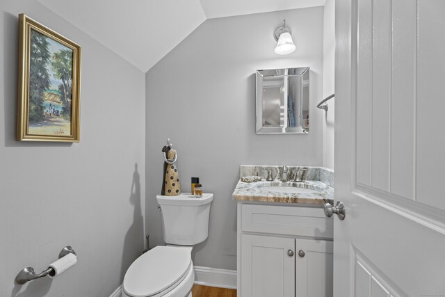 3 Arrowhead Rd, Madison, CT 06443 - bathroom featuring lofted ceiling, toilet, vanity, and baseboards