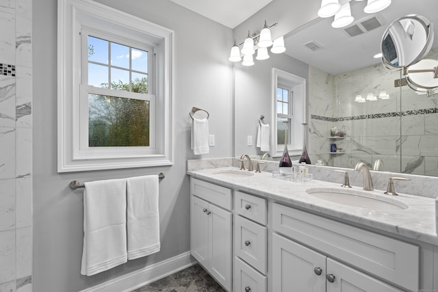 3 Arrowhead Rd, Madison, CT 06443 - bathroom featuring plenty of natural light, a marble finish shower, double vanity, and baseboards