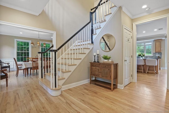 18 Beaver Dam Rd, Newtown, CT 06470 - stairs with wood finished floors, ornamental molding, recessed lighting, baseboards, and a chandelier