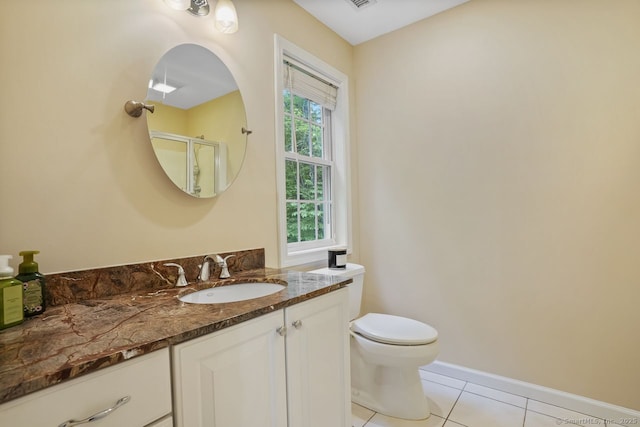 18 Beaver Dam Rd, Newtown, CT 06470 - full bath with tile patterned floors, toilet, vanity, a shower with shower door, and baseboards