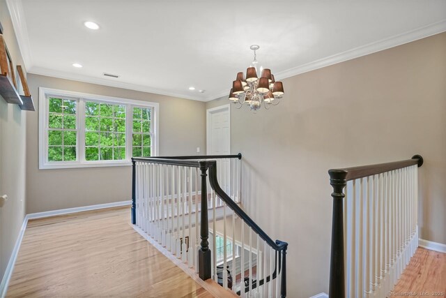 18 Beaver Dam Rd, Newtown, CT 06470 - corridor with an upstairs landing, a chandelier, baseboards, light wood-style flooring, and crown molding