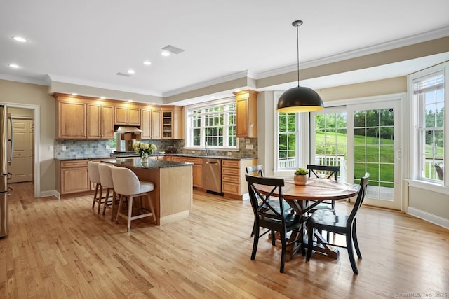 18 Beaver Dam Rd, Newtown, CT 06470 - kitchen with ornamental molding, stainless steel appliances, under cabinet range hood, a center island, and backsplash