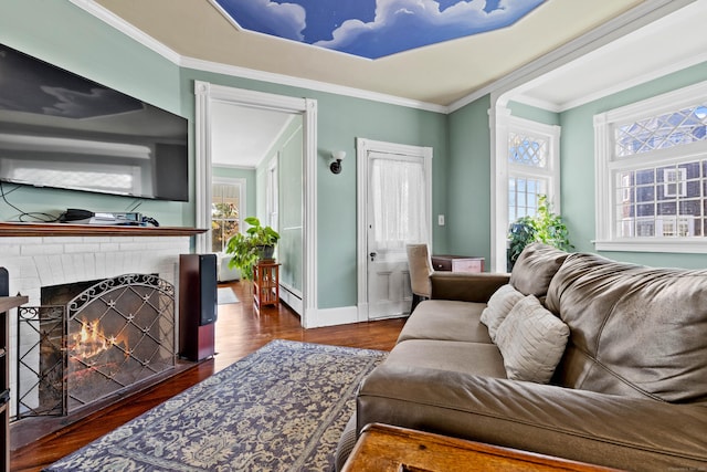 178 Shore Ave, Groton, CT 06340 - living area featuring wood finished floors, healthy amount of natural light, crown molding, a baseboard radiator, and a brick fireplace