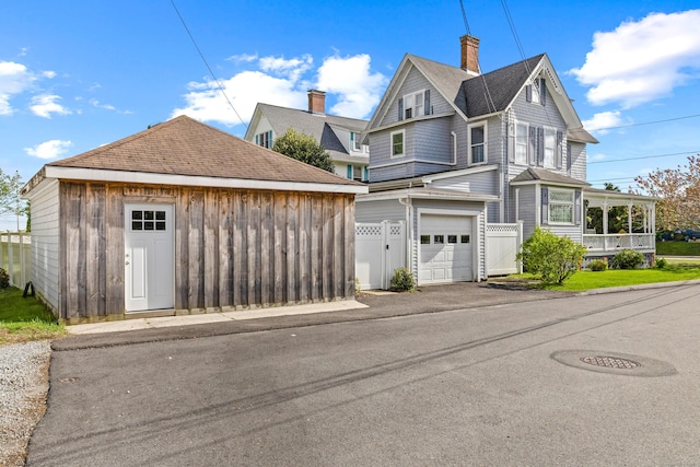 178 Shore Ave, Groton, CT 06340 - view of front of property with a chimney, a garage, and driveway