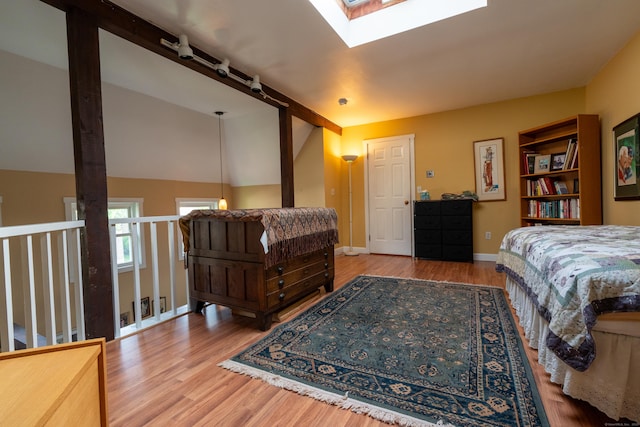 1 E Hayestown Rd Unit 24, Danbury, CT 06811 - bedroom with wood finished floors, baseboards, a skylight, and vaulted ceiling
