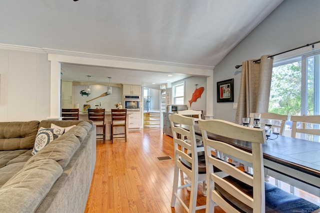 5 Quarry Rd, Stonington, CT 06355 - dining room featuring healthy amount of natural light, light wood finished floors, and vaulted ceiling